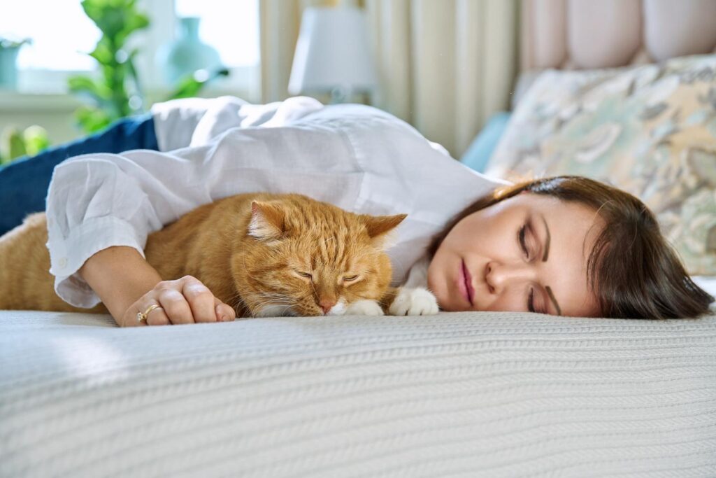 sleeping with cute cat